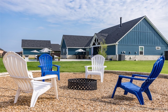 exterior space featuring a fire pit and central AC unit