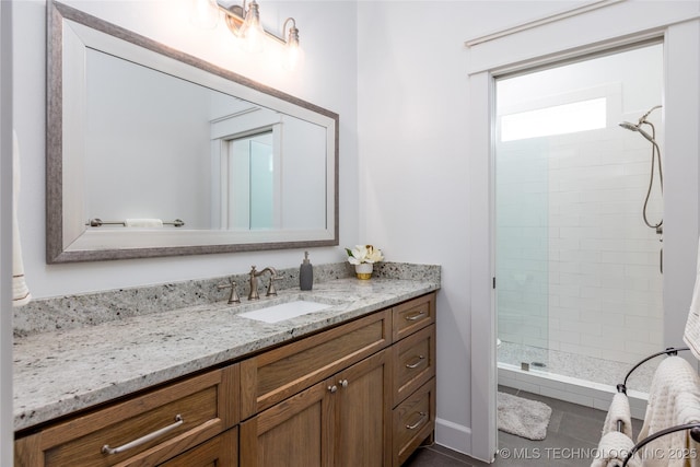full bath with vanity and a stall shower