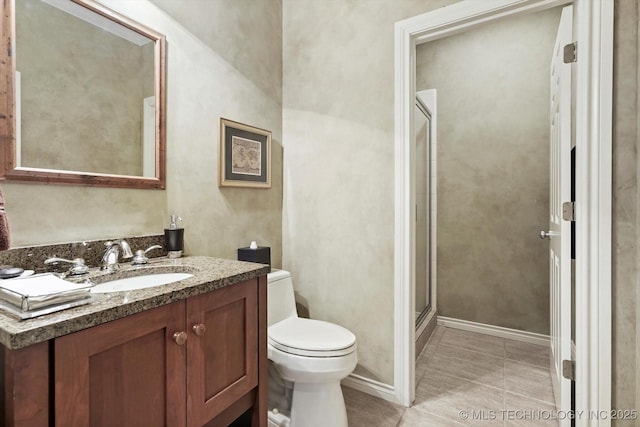 10135 S 78th E Ave, Tulsa, OK 74133 - bathroom with a shower stall, toilet, vanity, and tile patterned floors