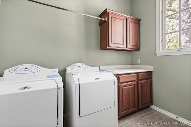 10135 S 78th E Ave, Tulsa, OK 74133 - laundry area featuring washing machine and dryer, baseboards, cabinet space, and light tile patterned floors