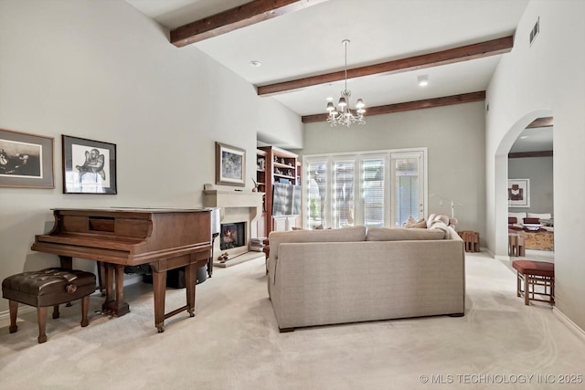 10135 S 78th E Ave, Tulsa, OK 74133 - living room with arched walkways, a warm lit fireplace, baseboards, and light carpet