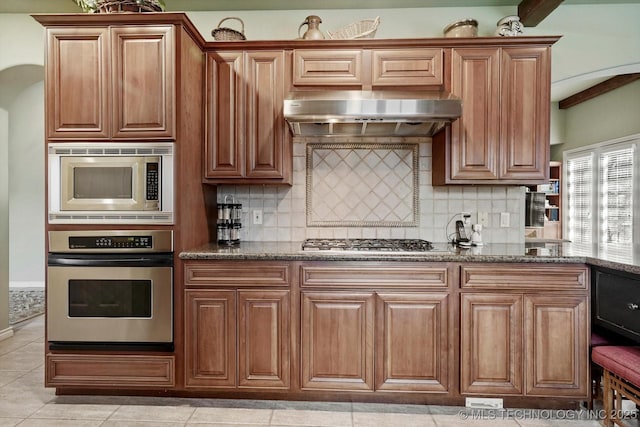10135 S 78th E Ave, Tulsa, OK 74133 - kitchen featuring decorative backsplash, appliances with stainless steel finishes, stone countertops, and under cabinet range hood