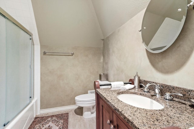 10135 S 78th E Ave, Tulsa, OK 74133 - full bathroom featuring vaulted ceiling, vanity, enclosed tub / shower combo, toilet, and tile patterned flooring
