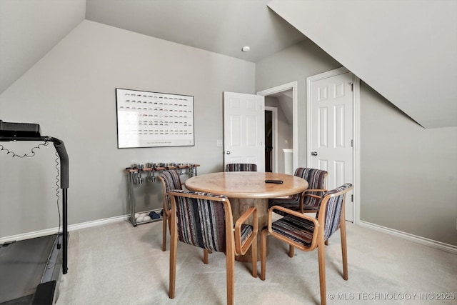10135 S 78th E Ave, Tulsa, OK 74133 - dining room featuring light carpet, lofted ceiling, and baseboards
