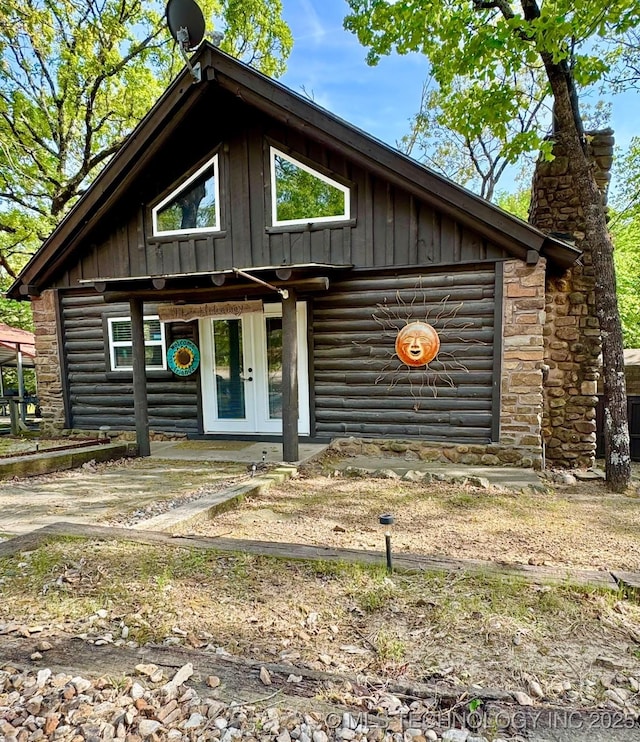 139 N Bk 1800 Rd, Stigler, OK 74462 - rustic home featuring board and batten siding, french doors, and a chimney