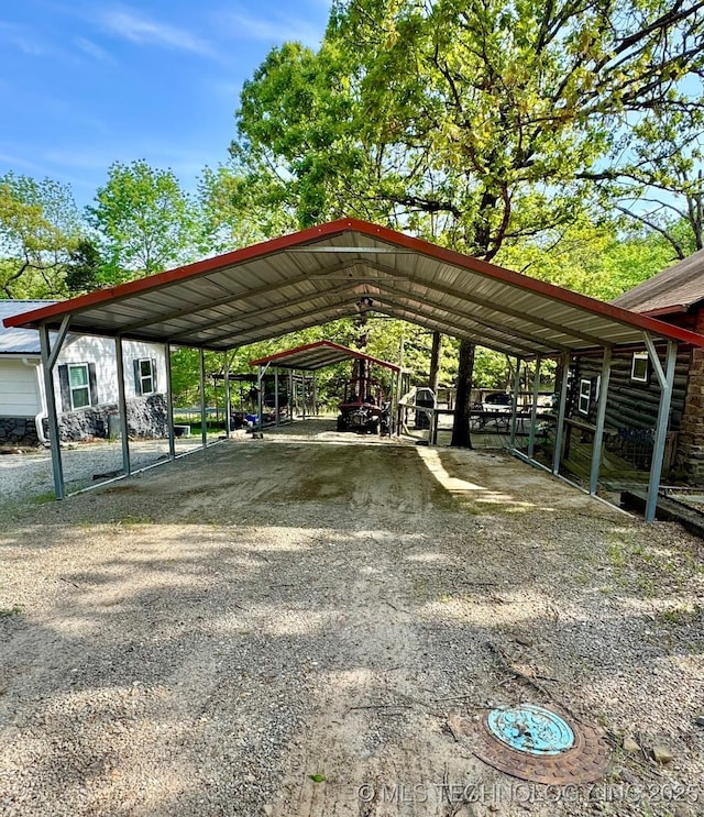 139 N Bk 1800 Rd, Stigler, OK 74462 - view of parking with a detached carport and dirt driveway