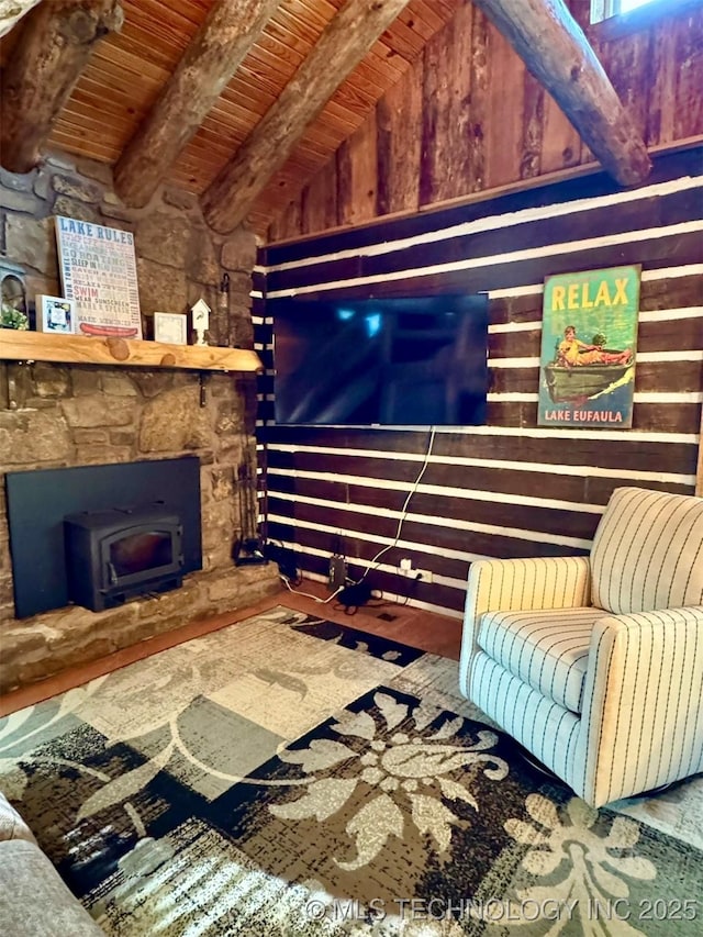 139 N Bk 1800 Rd, Stigler, OK 74462 - living room featuring wooden ceiling, a wood stove, and wooden walls