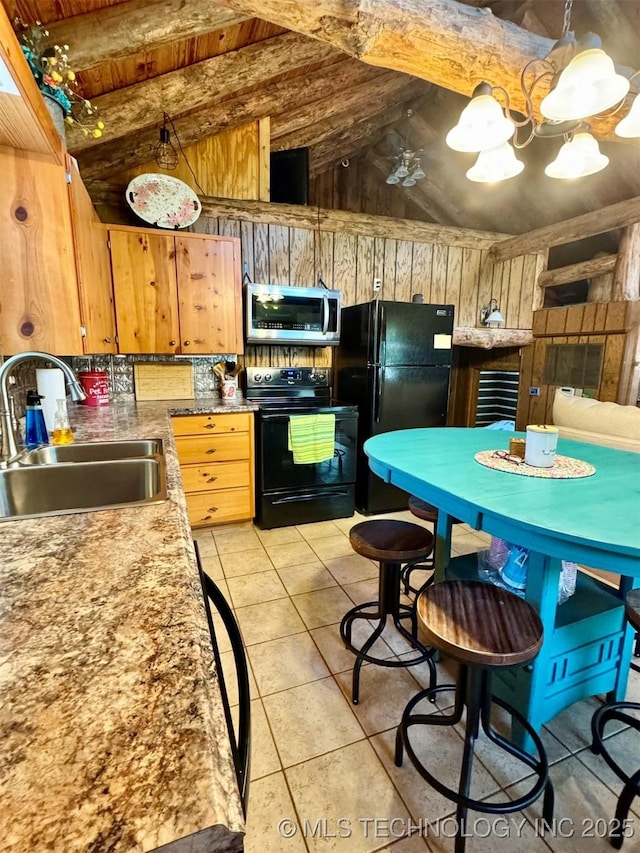 139 N Bk 1800 Rd, Stigler, OK 74462 - kitchen with black appliances, a sink, lofted ceiling, light tile patterned flooring, and wooden walls