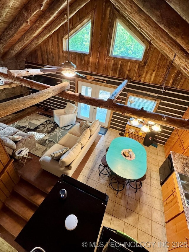139 N Bk 1800 Rd, Stigler, OK 74462 - playroom with lofted ceiling, wooden walls, french doors, and tile patterned flooring