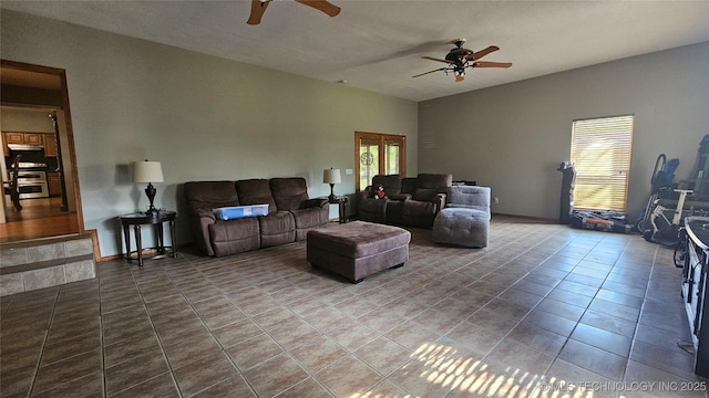 506 S Delaware Ave, Okmulgee, OK 74447 - tiled living room featuring ceiling fan