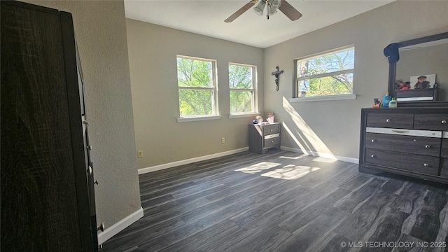 506 S Delaware Ave, Okmulgee, OK 74447 - bedroom featuring dark wood-type flooring, baseboards, and ceiling fan