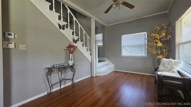 506 S Delaware Ave, Okmulgee, OK 74447 - interior space with wood finished floors, a ceiling fan, crown molding, baseboards, and stairs