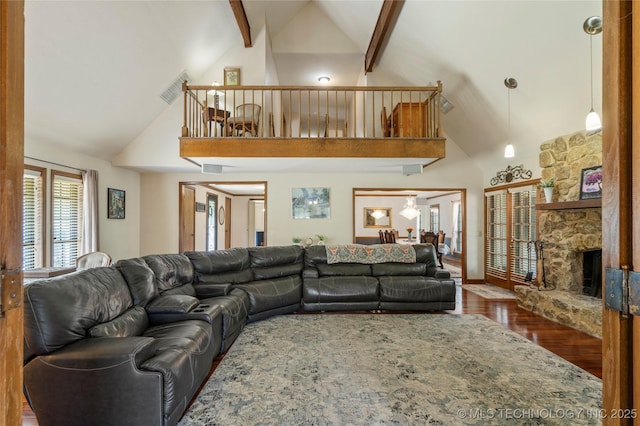 10421 S Richmond Pl, Tulsa, OK 74137 - living area featuring wood finished floors, beam ceiling, high vaulted ceiling, and visible vents