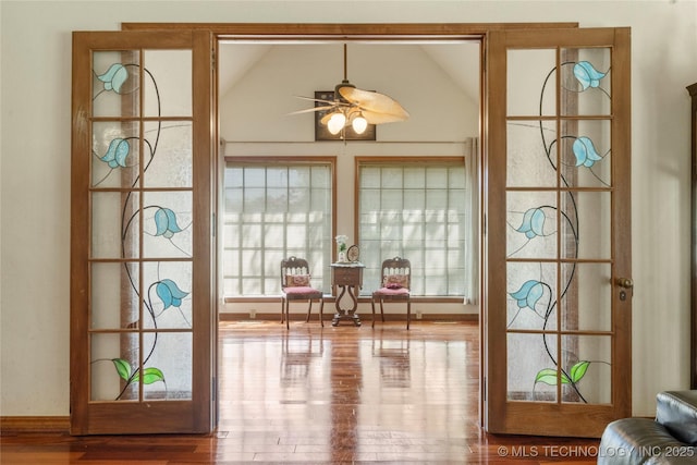 10421 S Richmond Pl, Tulsa, OK 74137 - doorway to outside with wood finished floors, lofted ceiling, and ceiling fan