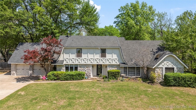 10421 S Richmond Pl, Tulsa, OK 74137 - view of front of house with a front lawn, driveway, stone siding, a shingled roof, and a garage