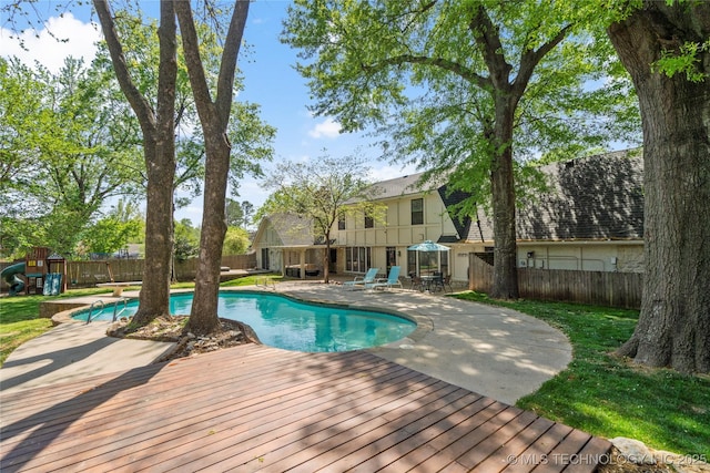 10421 S Richmond Pl, Tulsa, OK 74137 - view of swimming pool featuring a fenced backyard, a fenced in pool, a playground, and a patio