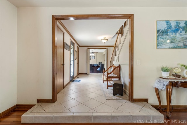 10421 S Richmond Pl, Tulsa, OK 74137 - corridor with baseboards, stairway, and light tile patterned flooring