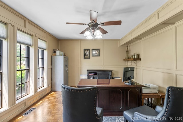 10421 S Richmond Pl, Tulsa, OK 74137 - home office with visible vents, a healthy amount of sunlight, and a decorative wall