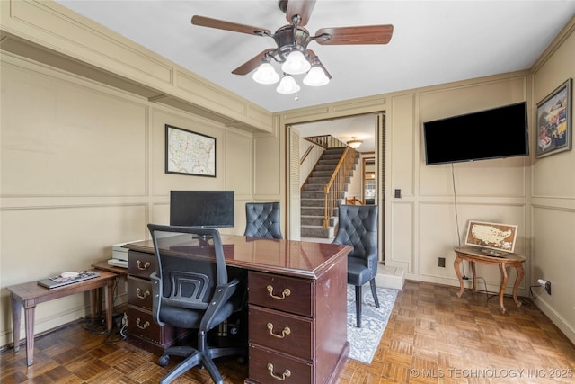 10421 S Richmond Pl, Tulsa, OK 74137 - home office with a ceiling fan and a decorative wall
