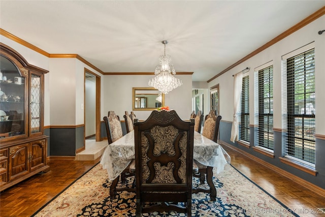10421 S Richmond Pl, Tulsa, OK 74137 - dining room with baseboards, a notable chandelier, and crown molding