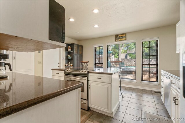 10421 S Richmond Pl, Tulsa, OK 74137 - kitchen featuring recessed lighting, white cabinets, open shelves, light tile patterned floors, and stainless steel electric range