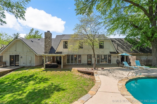 10421 S Richmond Pl, Tulsa, OK 74137 - rear view of property with a lawn, a chimney, a patio, a fenced in pool, and roof with shingles