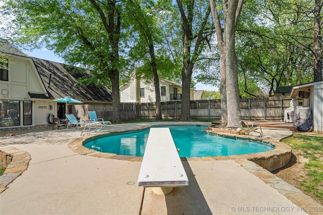 10421 S Richmond Pl, Tulsa, OK 74137 - view of swimming pool featuring a fenced backyard, a diving board, a patio area, and a fenced in pool