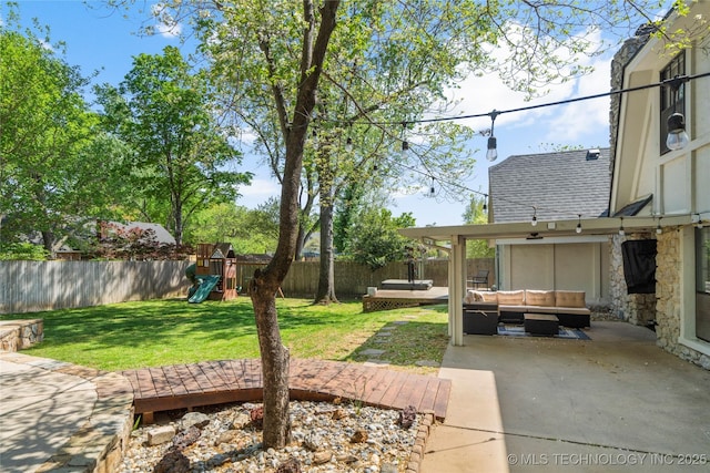 10421 S Richmond Pl, Tulsa, OK 74137 - view of yard with a fenced backyard, outdoor lounge area, a patio area, and a playground