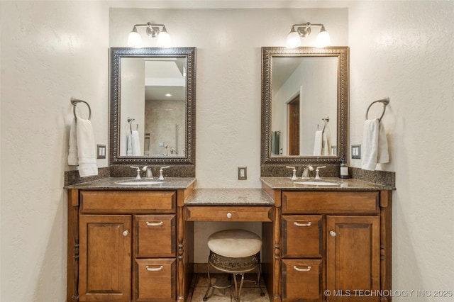 10421 S Richmond Pl, Tulsa, OK 74137 - full bathroom featuring a textured wall, a sink, and two vanities