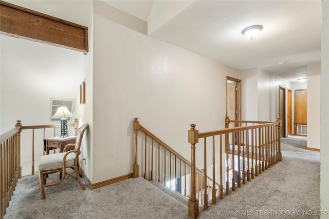 10421 S Richmond Pl, Tulsa, OK 74137 - hallway featuring baseboards, visible vents, carpet, and an upstairs landing
