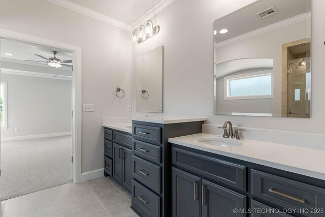 full bath with ceiling fan, visible vents, a sink, and ornamental molding