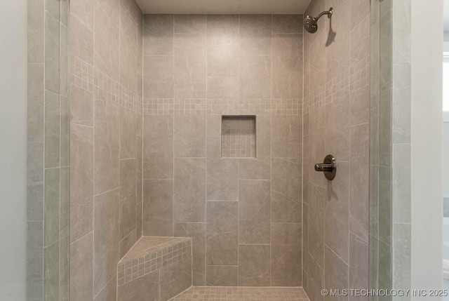 full bath with a shower stall