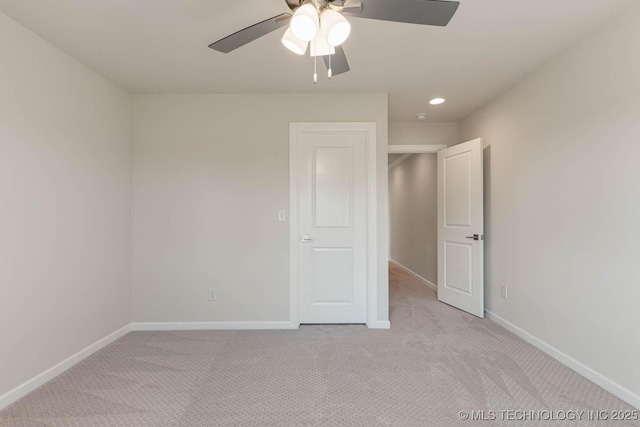 unfurnished bedroom with recessed lighting, ceiling fan, light carpet, and baseboards