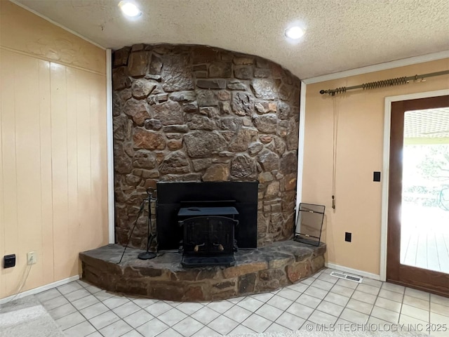 1380 N Lakeview Ave, Mannford, OK 74044 - unfurnished living room featuring a textured ceiling, tile patterned floors, baseboards, vaulted ceiling, and visible vents
