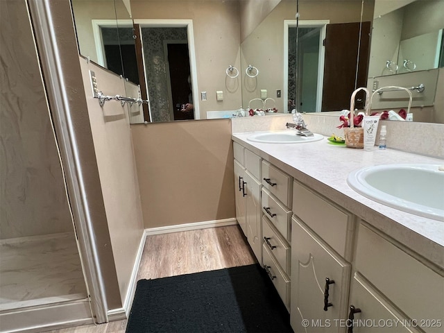 1380 N Lakeview Ave, Mannford, OK 74044 - bathroom with double vanity, baseboards, a sink, and wood finished floors