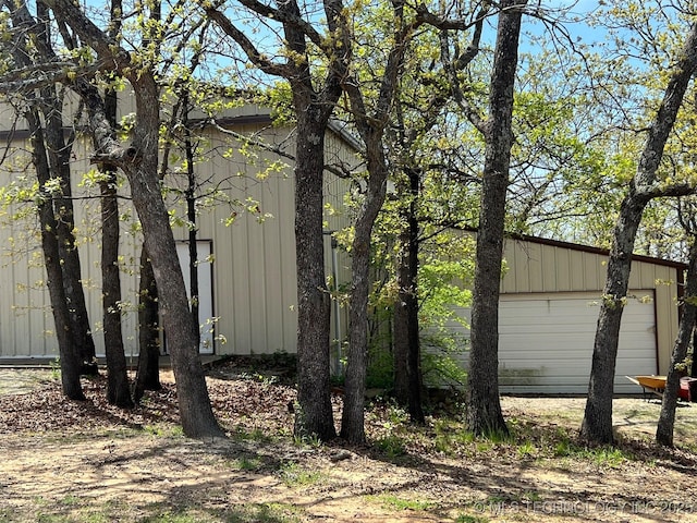 1380 N Lakeview Ave, Mannford, OK 74044 - view of side of home with an outdoor structure and board and batten siding