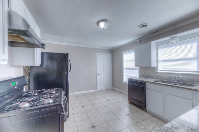 kitchen featuring wall chimney exhaust hood, white cabinets, a sink, visible vents, and black appliances