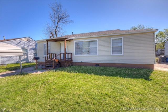 view of front of home with a front lawn and crawl space