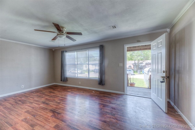 interior space featuring wood finished floors, crown molding, baseboards, and ceiling fan