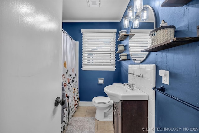 4222 E 25th St, Tulsa, OK 74114 - full bathroom with tile patterned floors, vanity, toilet, baseboards, and curtained shower