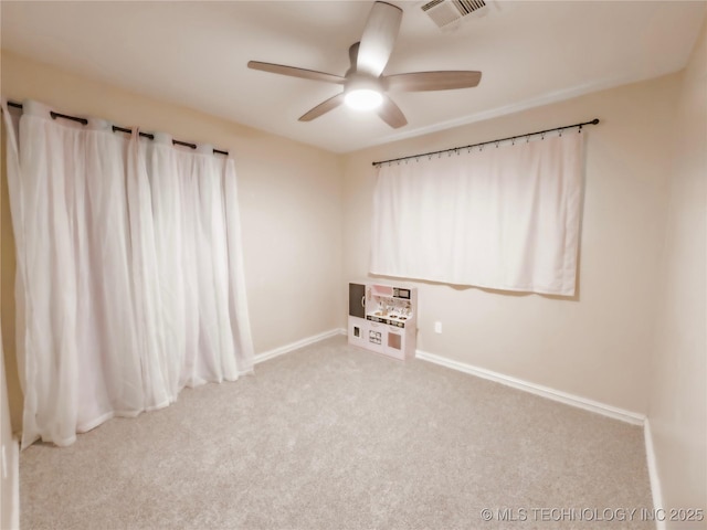 322 E Maple St, Skiatook, OK 74070 - empty room featuring a ceiling fan, visible vents, carpet floors, and baseboards