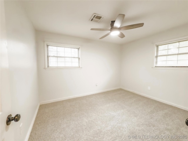 322 E Maple St, Skiatook, OK 74070 - unfurnished room with a ceiling fan, visible vents, carpet floors, and baseboards