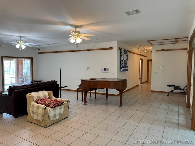 living room with light tile patterned floors, track lighting, visible vents, and ceiling fan