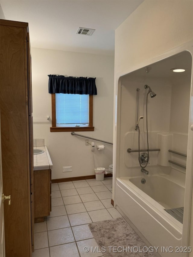 full bathroom featuring tile patterned flooring, visible vents, toilet, vanity, and baseboards