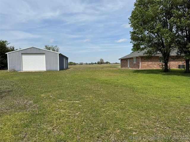 402325 W 2100th Rd, Bartlesville, OK 74006 - view of grassy yard featuring a garage and an outdoor structure