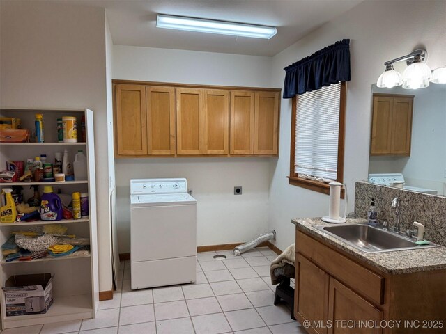 402325 W 2100th Rd, Bartlesville, OK 74006 - clothes washing area with washer / clothes dryer, cabinet space, and light tile patterned floors