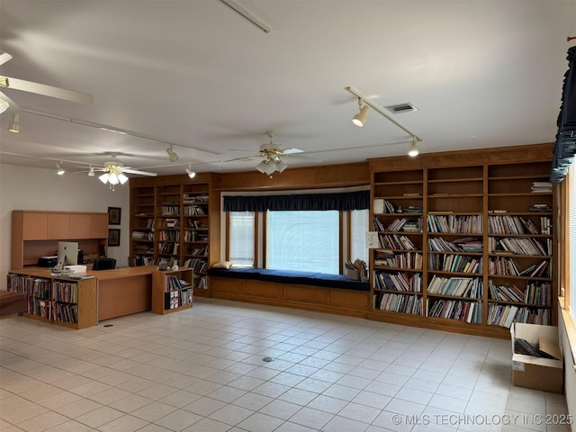 402325 W 2100th Rd, Bartlesville, OK 74006 - living area with track lighting, ceiling fan, and built in features