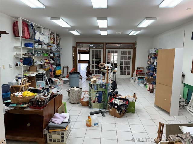 misc room featuring french doors and light tile patterned flooring