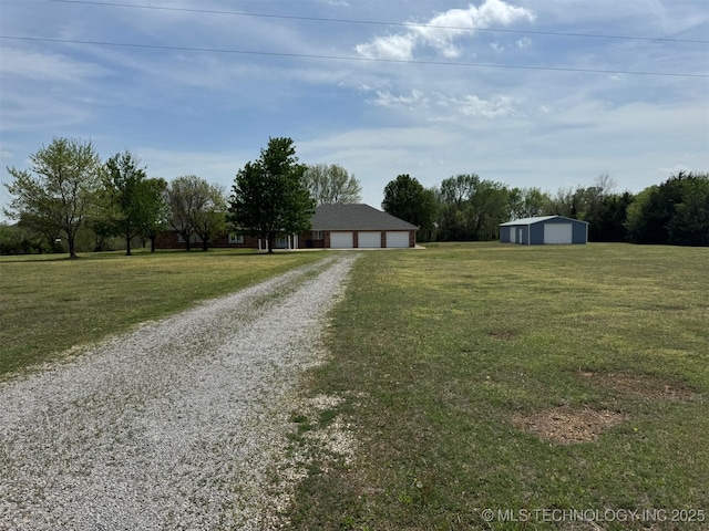402325 W 2100th Rd, Bartlesville, OK 74006 - view of dirt / gravel driveway with a pole building