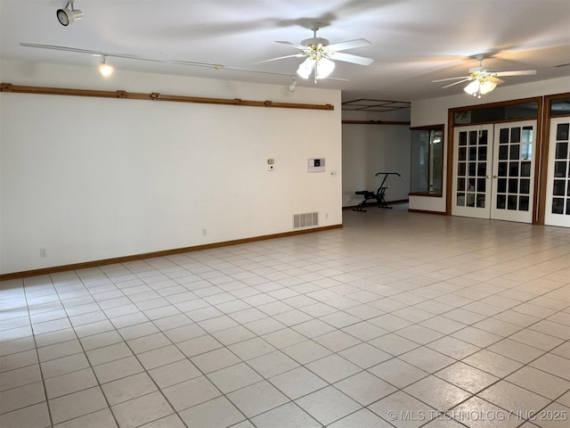 402325 W 2100th Rd, Bartlesville, OK 74006 - unfurnished room with ceiling fan, french doors, and baseboards